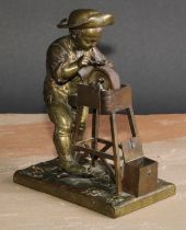 An unusual 19th century French bronze automaton table vesta, as a young knife grinder, his wheel