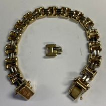 A 9ct gold bracelet, one spare link