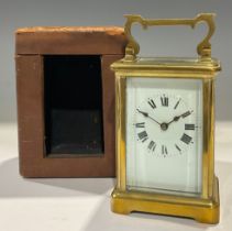 A 19th century French lacquered brass carriage timepiece, 15cm high over carry handle, cased