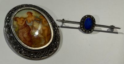 A 925 silver and marcasite brooch, set with porcelain plaque; another brooch