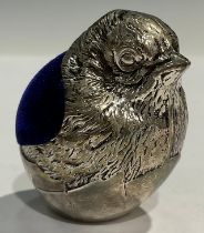 A silver plated novelty miniature pincushion, modelled as a chick emerging from an eggshell, 4cm