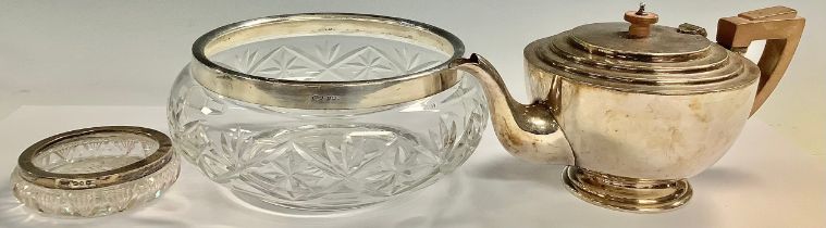 An Art Deco silver plated teapot, c.1940; a George V silver mounted salad bowl, London 1928; a