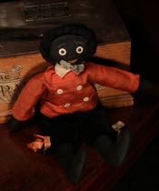 Folk Art - an early 20th century stuffed cloth black doll, the fabric head applied with black and