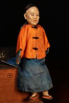 An early 20th century Chinese Door of Hope Mission 'Grandfather' doll, the painted papier-mâché head