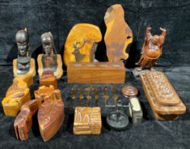 A Japanese carved Buddha figure; two African carved hardwood busts; a set of six celluloid