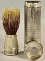 A Victorian silver cylindrical travelling shaving brush, engine turned