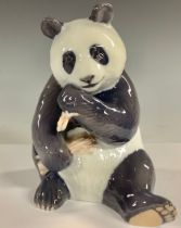 A Royal Copenhagen model of a Panda, seated chewing bamboo, number 662, 17.5cm, printed mark