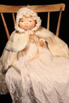 A 1920's Borgfeldt painted composition head 'Bye-Lo Baby' doll, designed by Grace Storey Putnam, the