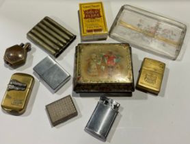 A Hadson flip top lighter, applied with crocodile's head; others, Zippo, etc; a Rowntrees Cocoa
