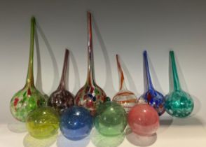 A collection of six free blown glass plant watering globes, various colours and sizes, the largest