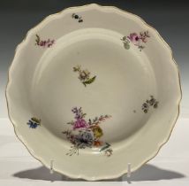 A Meissen dish, painted with deutsche blumen, 22cm diam, impressed 16, blue crossed swords mark