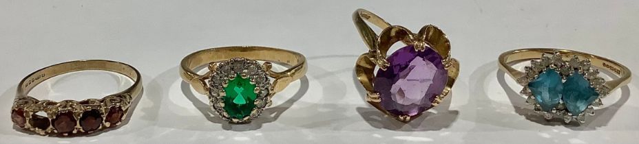 A 9ct gold dress ring set with a single faceted amethyst, flower head bezel, size P, marked 375, 3.
