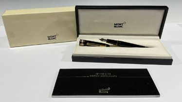 A Montblanc Meisterstuck Fountain Pen with black resin barrel and cap, gilt clip and banding, 14ct