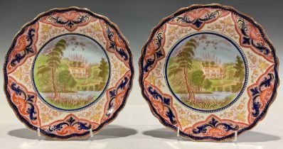 A pair of Ruskin Burslem shaped circular plates, each depicting Ruskin's house, 24.5cm diam. C.1890