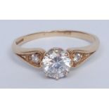 A diamond solitaire ring, the brilliant cut stone approx 0.5ct, claw set, the shoulders with further