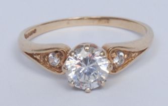 A diamond solitaire ring, the brilliant cut stone approx 0.5ct, claw set, the shoulders with further