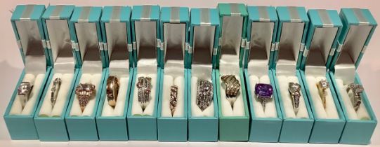 An Italian silver gilt dress ring, star cut, boxed; other sterling silver dress rings, set with