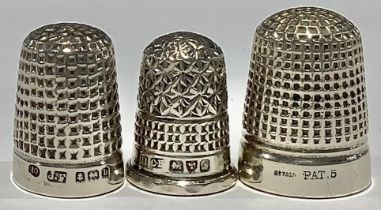 A Charles Horner silver thimble, Chester 1909; another silver thimble, Birmingham 1901; etc (3)