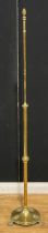 An early 20th century brass telescopic floor lamp, paw feet, 119cm raising to 173cm under fitting