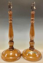 A pair of turned oak table lamps, one mounted with plaque inscribed 'Oak from original beams taken