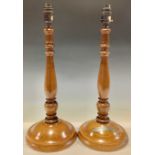 A pair of turned oak table lamps, one mounted with plaque inscribed 'Oak from original beams taken