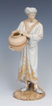 A Royal Worcester figure, of a Middle Eastern water carrier, decorated in flesh tones and gilt,