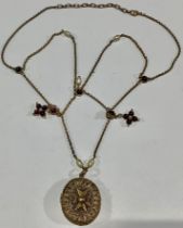 An ornate filigree locket, mounted with Maltese cross, on stone set chain