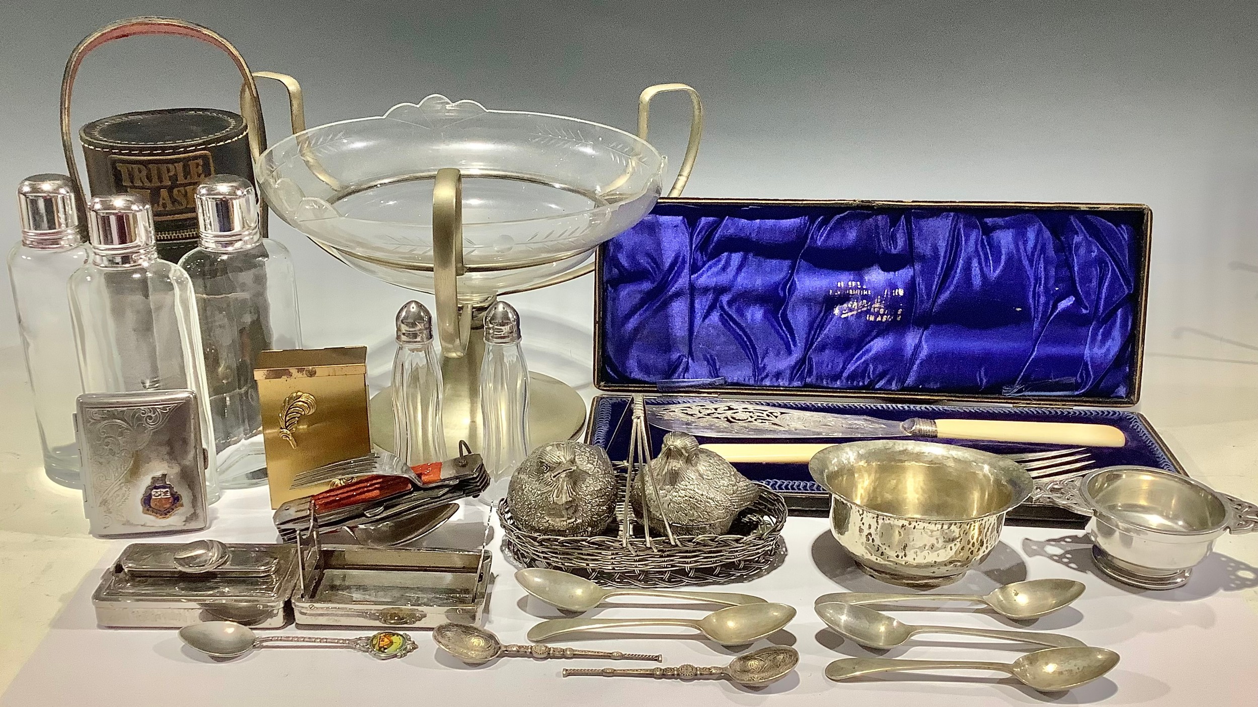 An EPNS mounted Art Deco style table centre, engraved clear glass dish; a triple flask; a novelty