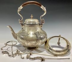 An 18th century style plated tea kettle on stand, engraved with foliage in low relief, hardwood