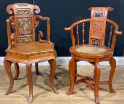 A Chinese parcel-gilt hard and softwood elbow chair, the back carved with figures and dragons, 84.