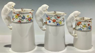 A graduating set of three Spode Copeland's China milk jugs, the handles modelled as cats, each