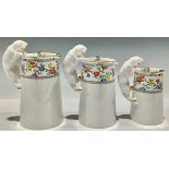 A graduating set of three Spode Copeland's China milk jugs, the handles modelled as cats, each