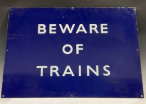 A rectangular blue enamel railway sign, Beware of Trains, mid 20th century, 48.5cm x 68.5cm