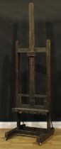 A 19th century artist's studio painting easel, adjustable on a pulley system, H-shaped base,