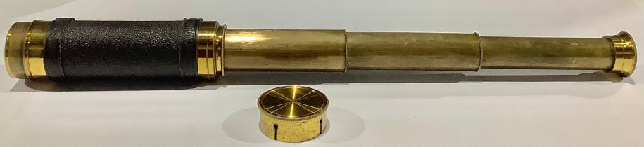 A late Victorian/Edwardian lacquered brass and textured 'shagreen' three-draw pocket telescope,