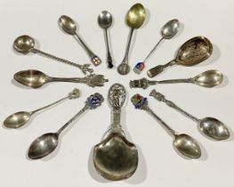 A continental silver caddy spoon, the openwork terminal as a wreathed cupid atop a classical column,