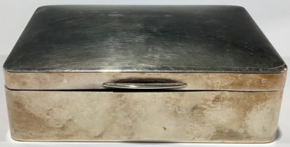 A silver rounded rectangular cigarette box, 13cm wide, Birmingham 1921