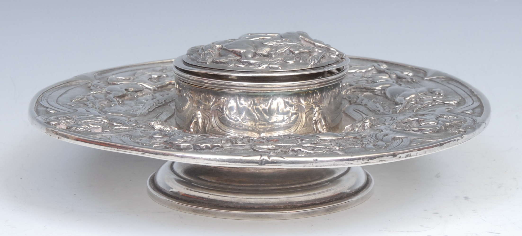 A Renaissance Revival electrotype circular inkwell, in relief with horse racing, chariot racing, and