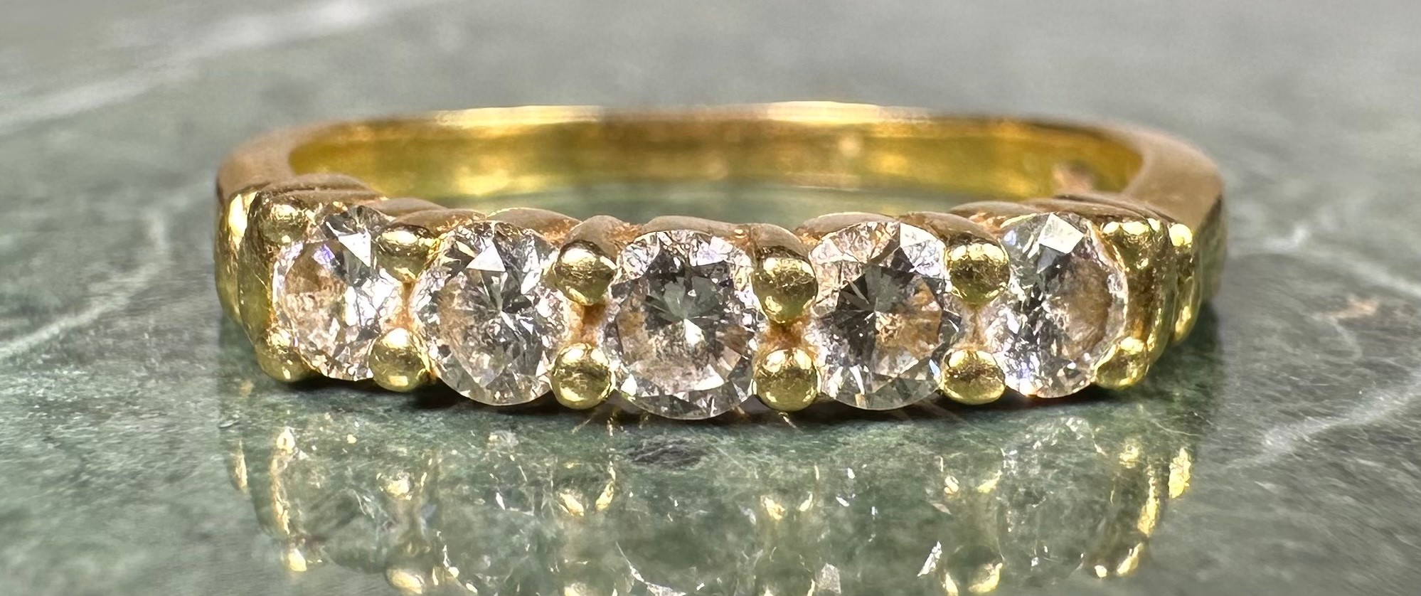 A diamond ring, linear set with five round brilliant cut diamonds, total estimated diamond weight - Image 2 of 4