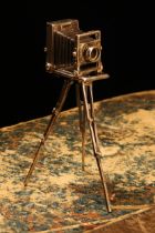 An Elizabeth II silver novelty toy miniature model, of a Victorian plate camera on tripod, 9cm high,