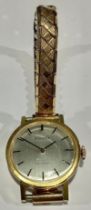 A lady's Tissot Stylist gold plated watch, brushed steel dial, baton indicators, 2.5cm diameter,
