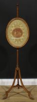 A Sheraton Revival painted pole screen, oval banner, outswept legs, paw feet, 143cm high, c.1900