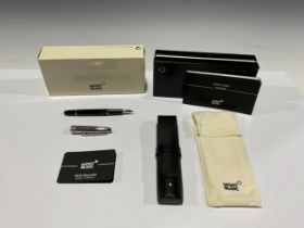 A Montblanc Meisterstuck Fountain Pen with black resin barrel and white metal cap, clip and banding,