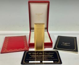 A Cartier lighter, boxed with papers