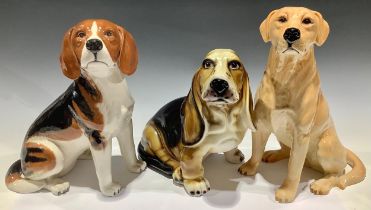 A Beswick fireside model, of as Beagle, 2300, 32cm high; another, Golden Retriever, 7314, 34cm high;