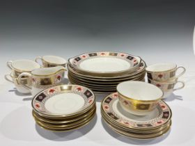 A Royal Crown Derby tea service for six, Derby Border, comprising cake plate, side plates, cream