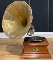 A table-top horned gramophone, the soundbox marked “His Master’s Voice”