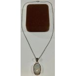 A silver pendant, set with oval cabochon quartz with 'moonstone' flare, marked 925