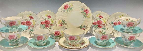 An Aynsley tea service for six, printed with poppies and other flowers, comprising cake plate,