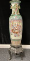 A large Cantonese vase, 38.5" high, on carved stand